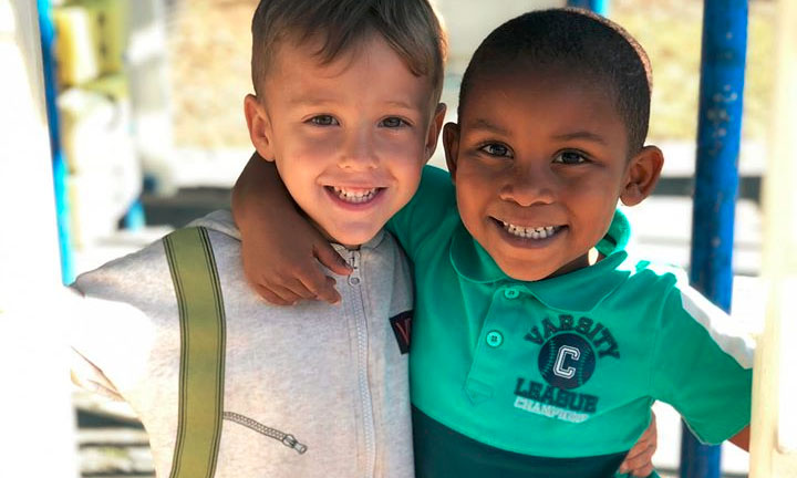 Happy little young boys enjoying at the playground at a Preschool & Daycare Serving Hampton Roads, VA