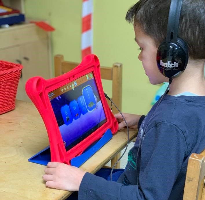 Preschooler getting advance lessons using their school tablet at a Preschool & Daycare Serving Hampton Roads, VA