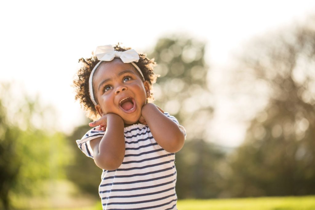 Cute happy smiling little preschool girl in the playground at a Preschool & Daycare Serving Hampton Roads, VA