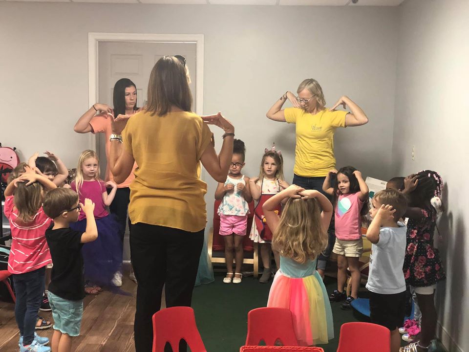 nursery children together with their teachers enjoying some school activities at a Preschool & Daycare Serving Hampton Roads, VA